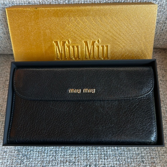 Miu Miu Handbags - EUC Miu Miu Black and Gold Pebbled Leather Clutch
